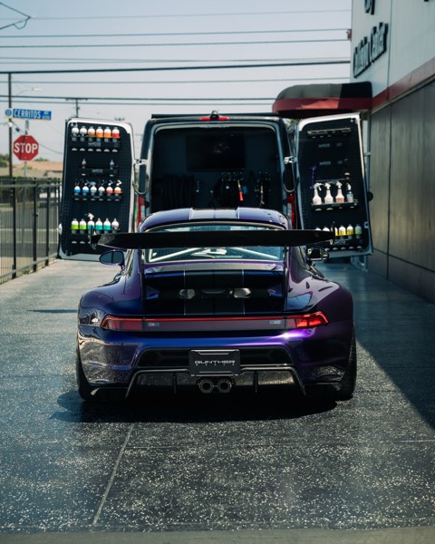 GW Porsche straight rear shot between open van doors
