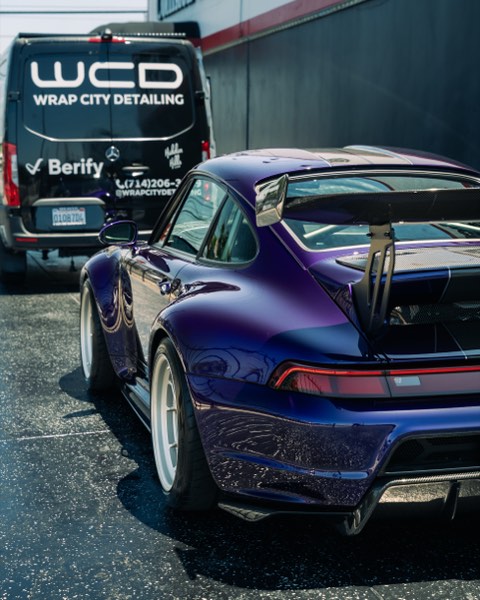 GW Porsche rear three-quarter with Wrap City Detailing van branding